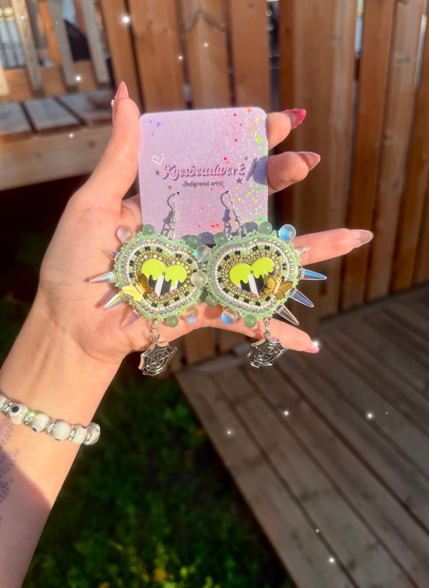 Green spiked Beaded Earrings With Spider Web Charms